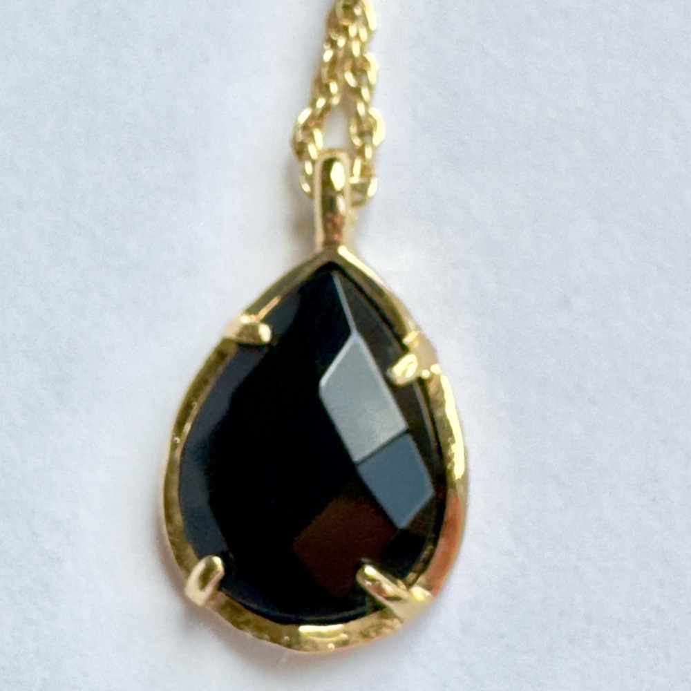 Kendra Scott Elegant Black and Gold Teardrop Pendant Necklace.